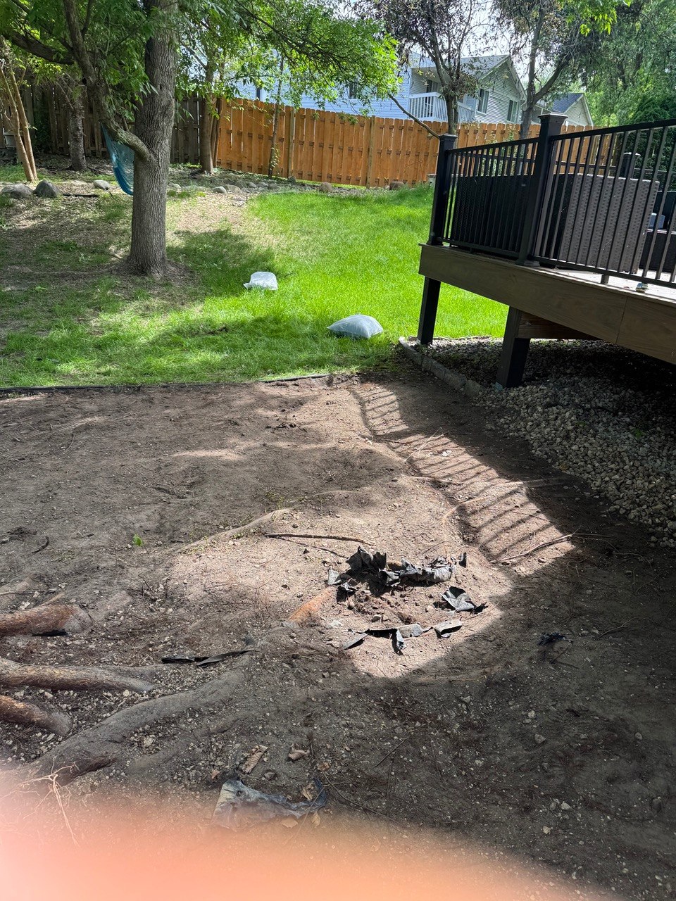 Fence line gravel cleanup after